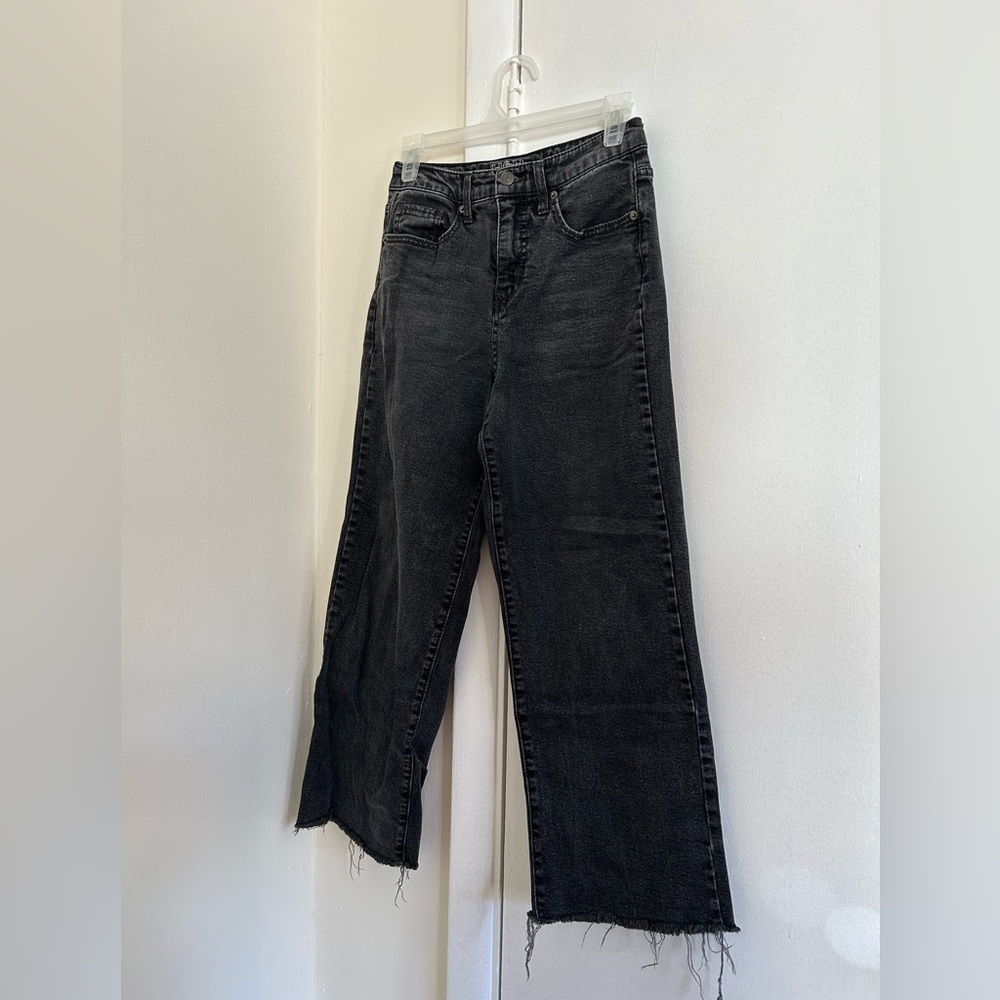 Black high waisted, wide leg jeans with frayed hem